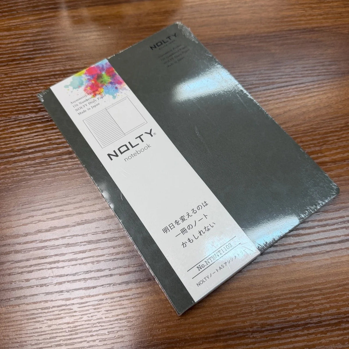 NOLTY A5 Notebook with khaki cover and asymmetry (lined on left page, dot grid on right page) layout.