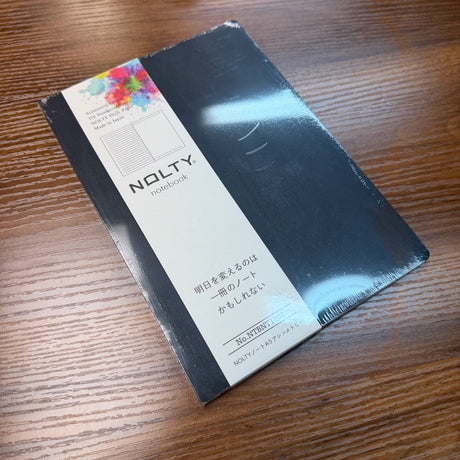 NOLTY A5 Notebook with black cover and asymmetry (lined on left page, dot grid on right page) layout.