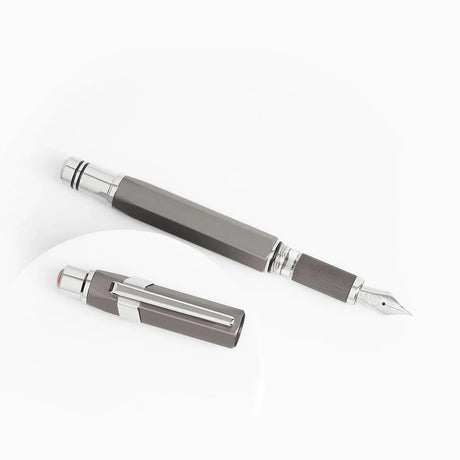 Gunmetal Grey TWSBI Precision fountain pen with silver accents on a white background
