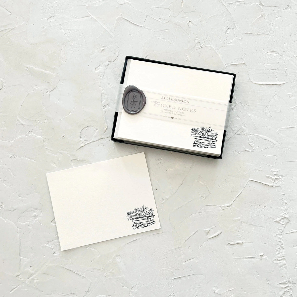 Belle & Union Boxed Notes White paper featuring a book with flowers