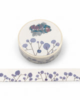 Washi sample and roll with a design of straight stems with purple dots like leaves on a light background, created with fountain pen ink.
