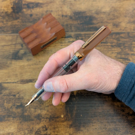 TWSBI Espresso Bronze held in-hand posted
