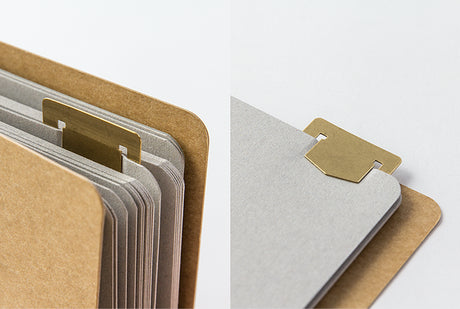 TRAVELER's Company Brass Template Bookmarks Shown Clipped To notebook