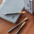 Blackwing 602 Short Pencil on desk with notebook