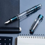 TWSBI Diamond 580 ALR Prussian blue Uncapped on Leather Notebooks