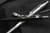 TWSBI Precision Ballpoint Pen in Black and Silver atop Denim fabric