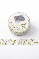 Washi sample and roll with a design of curvy stems with round green dots like leaves on a light background, created with fountain pen ink.